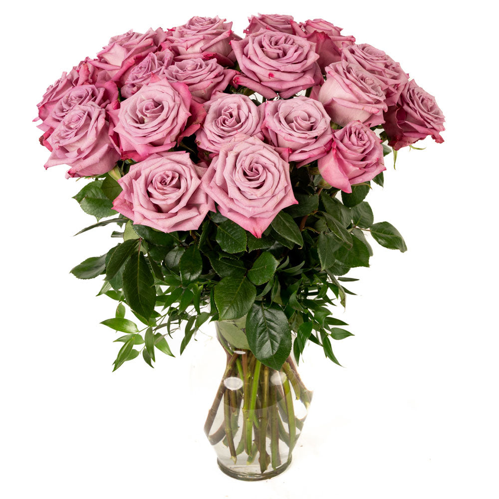 A stunning bouquet of pink roses in a glass vase, perfect for special occasions or home decor.