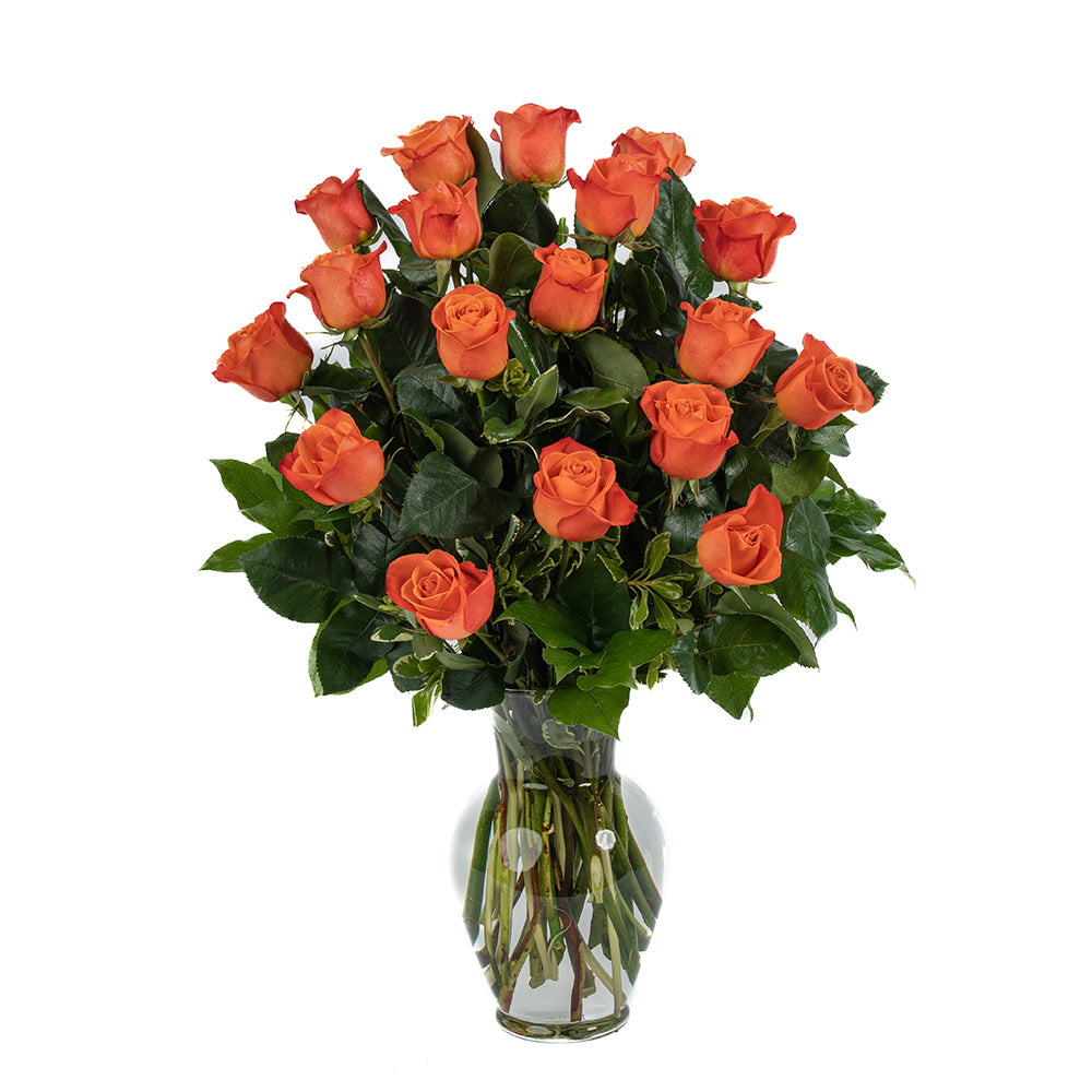 A stunning bouquet of 20 vibrant orange roses arranged elegantly in a clear glass vase.