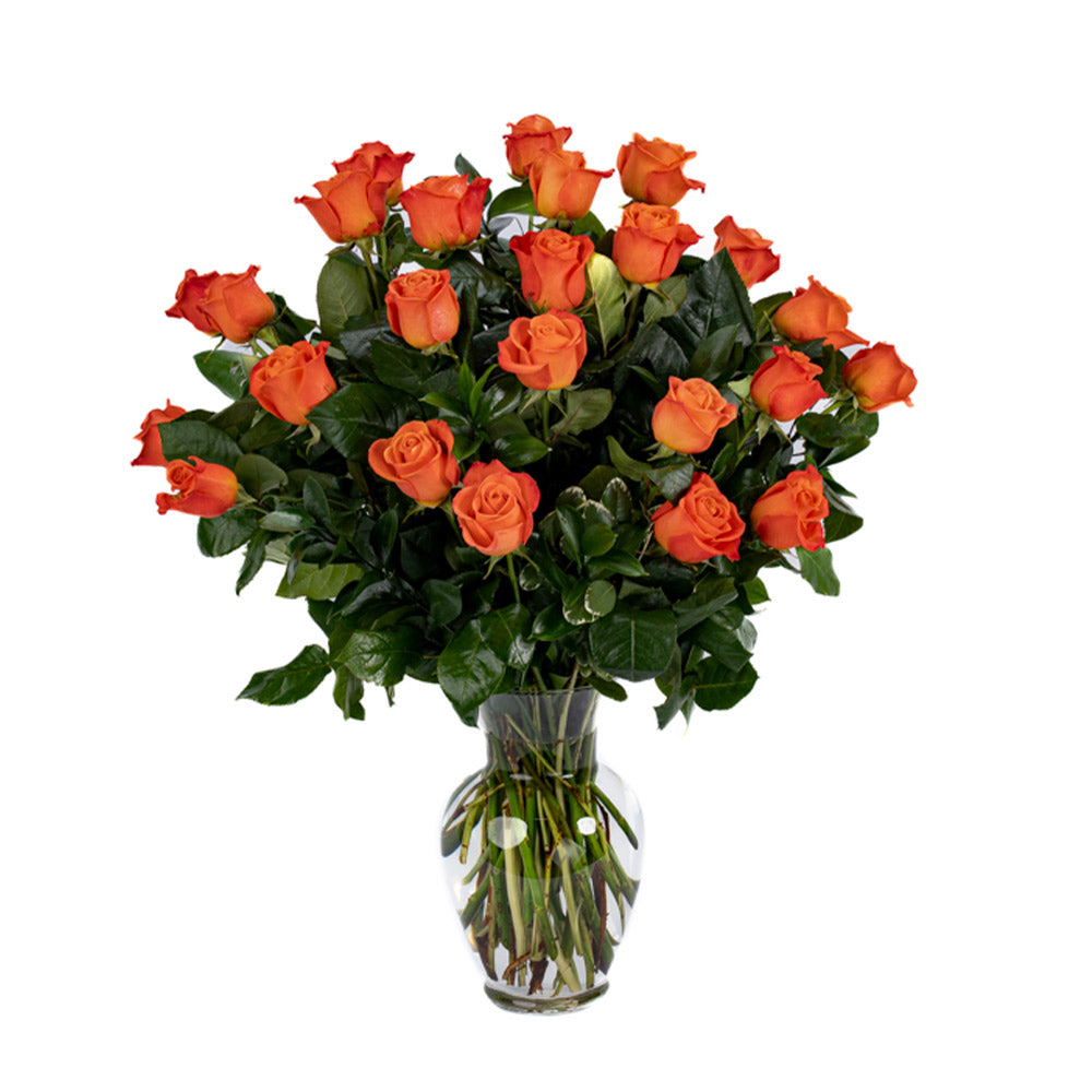 A vibrant bouquet of orange roses beautifully arranged in a clear vase, perfect for special occasions.