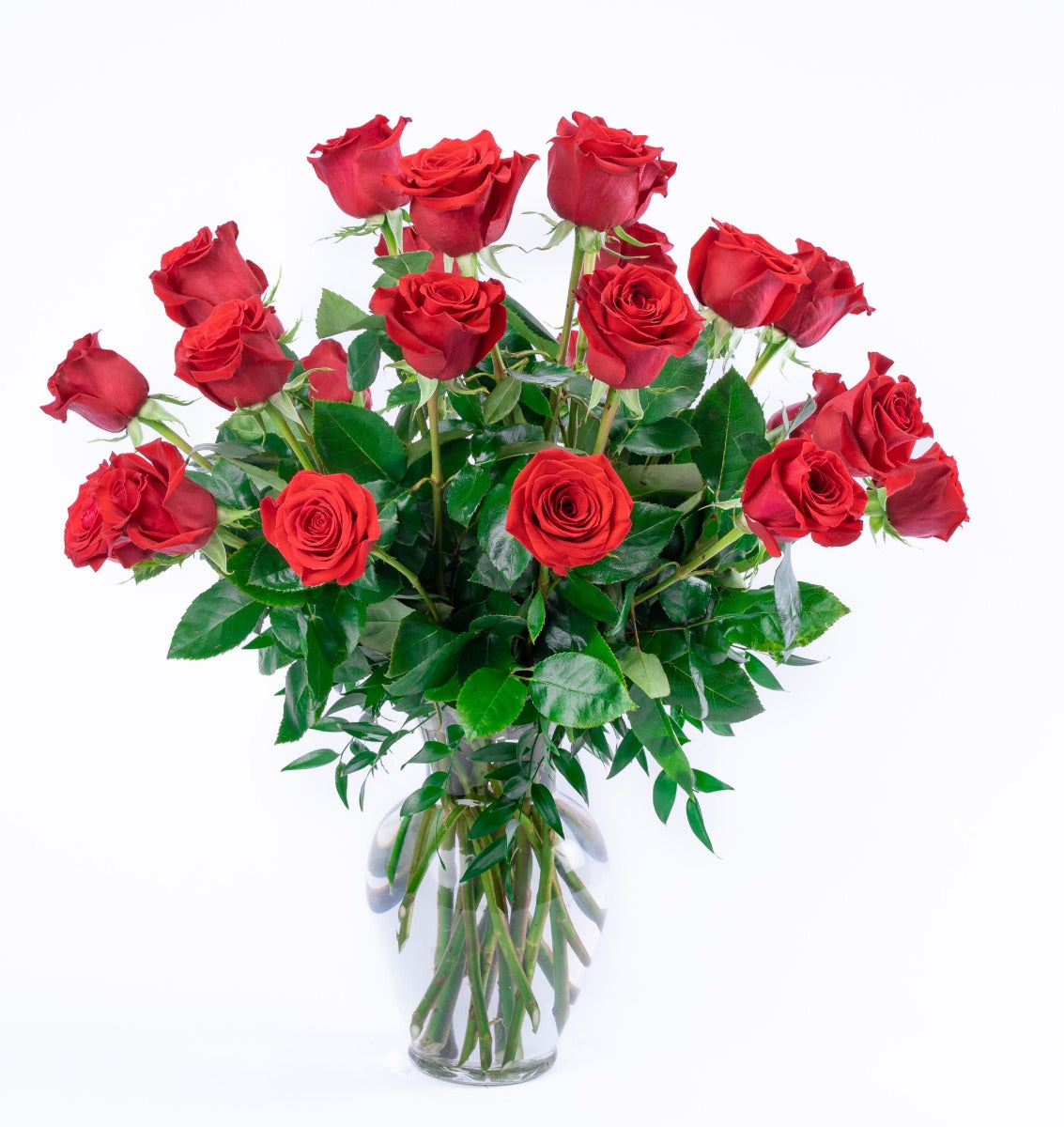 Elegant bouquet of vibrant red roses arranged in a clear glass vase, perfect for any celebration.