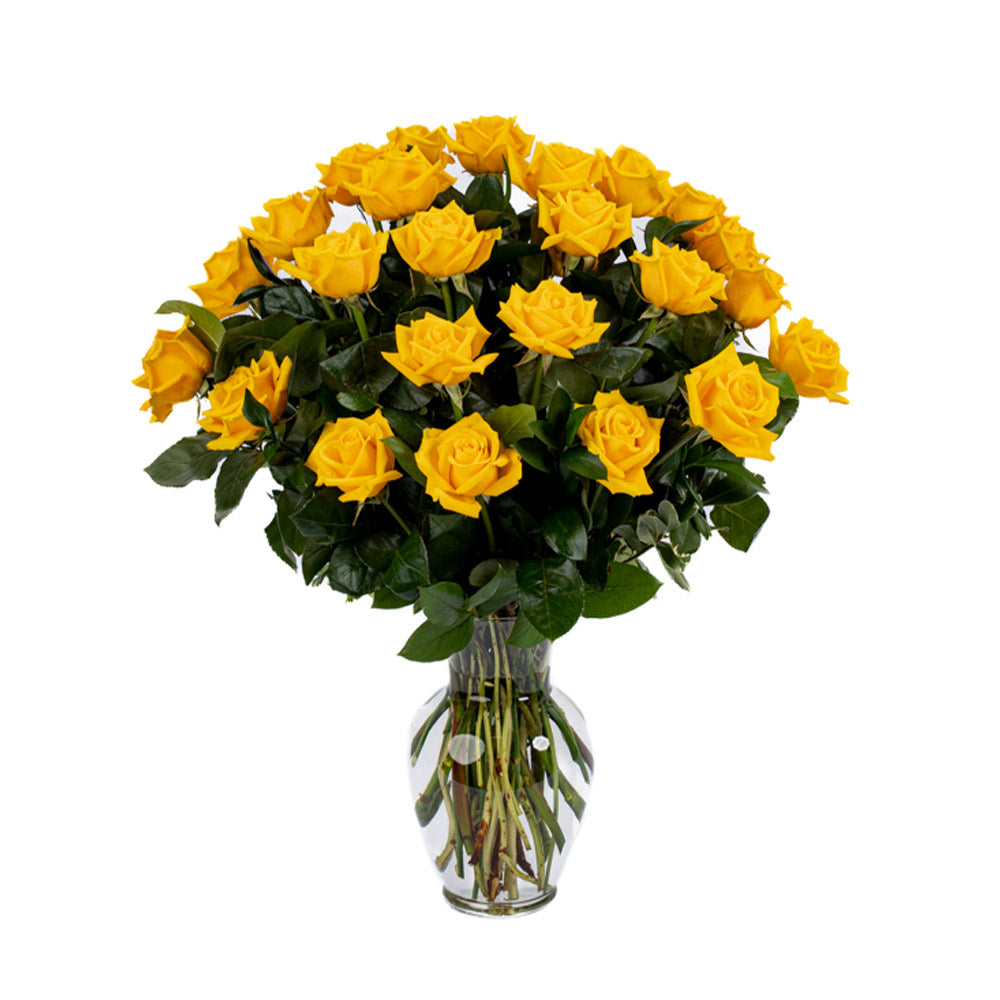 A vibrant bouquet of bright yellow roses in a clear glass vase, perfect for uplifting any space.